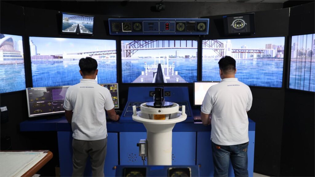 Trainees using the bridge simulator
