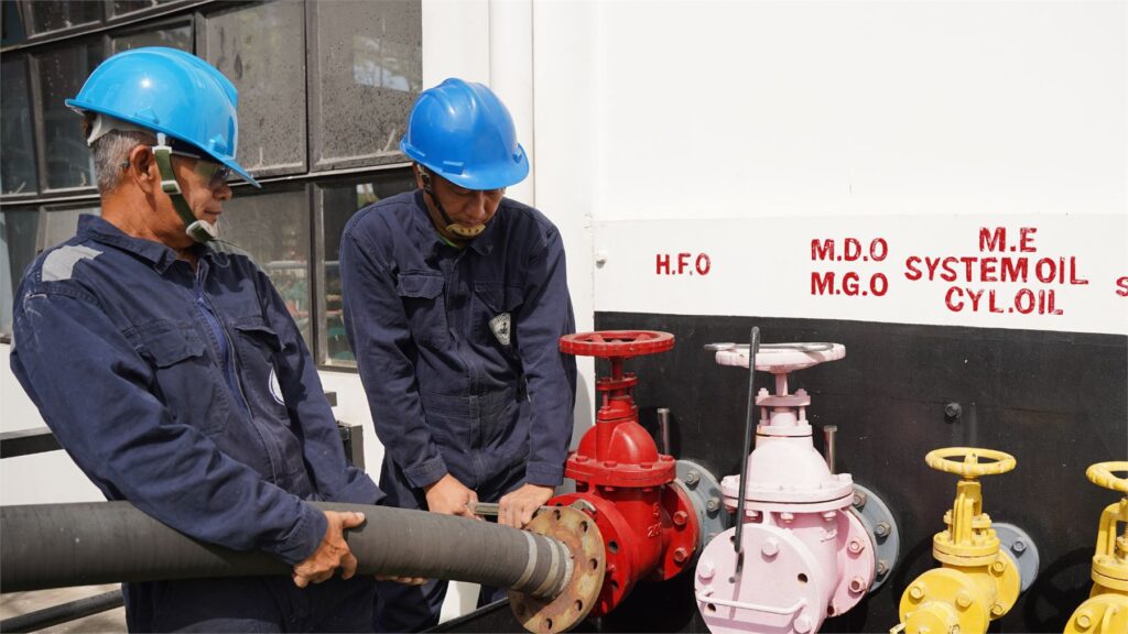 Trainees practicing a bunkering hose connection